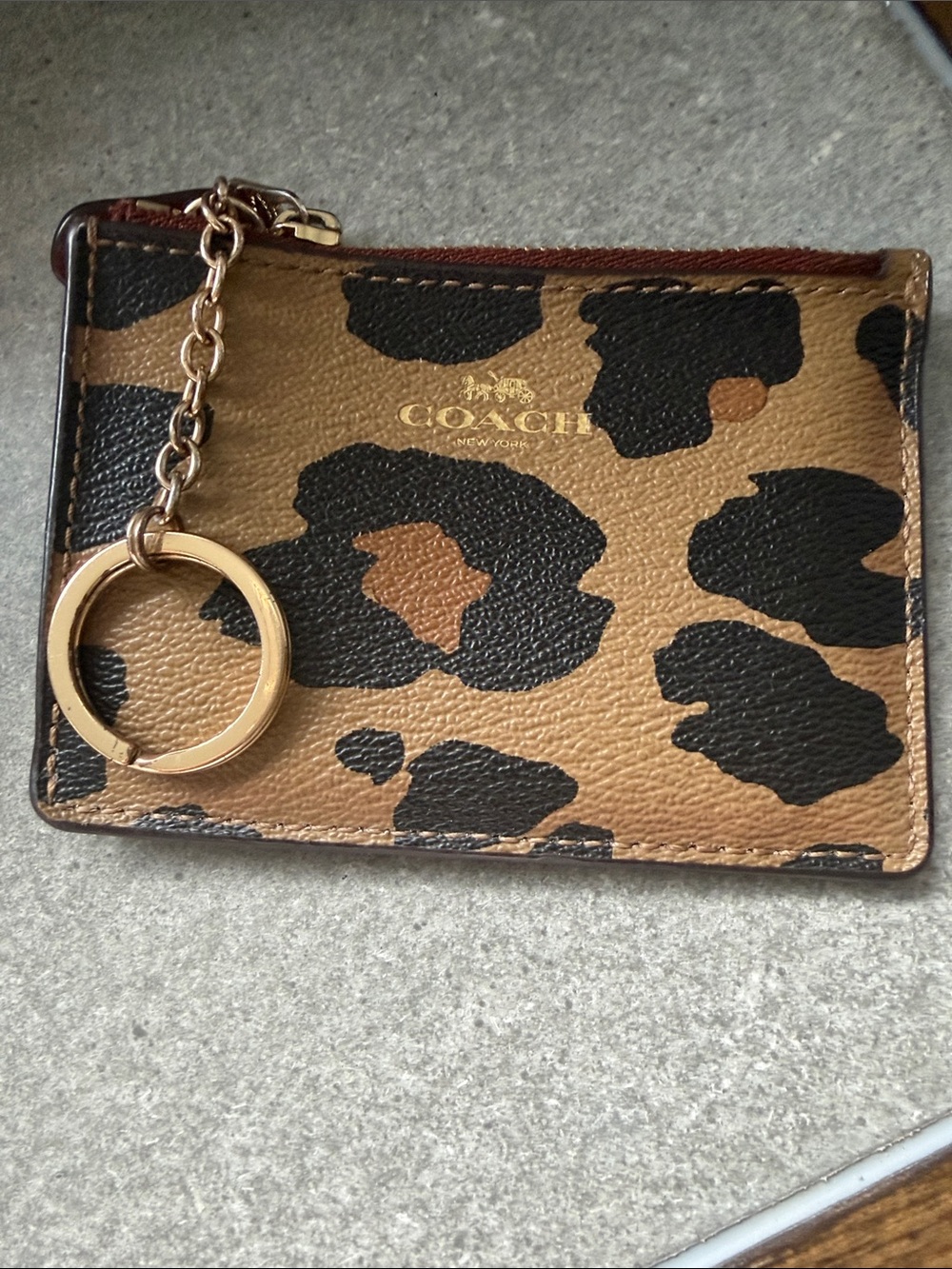 Coach Mini Skinny ID Case featuring a leopard print pattern